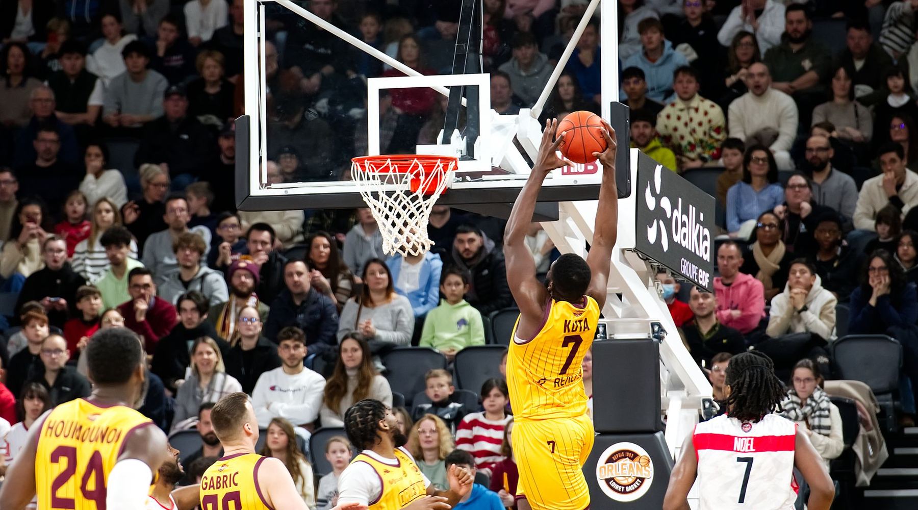 Basketball game inside a packed arena